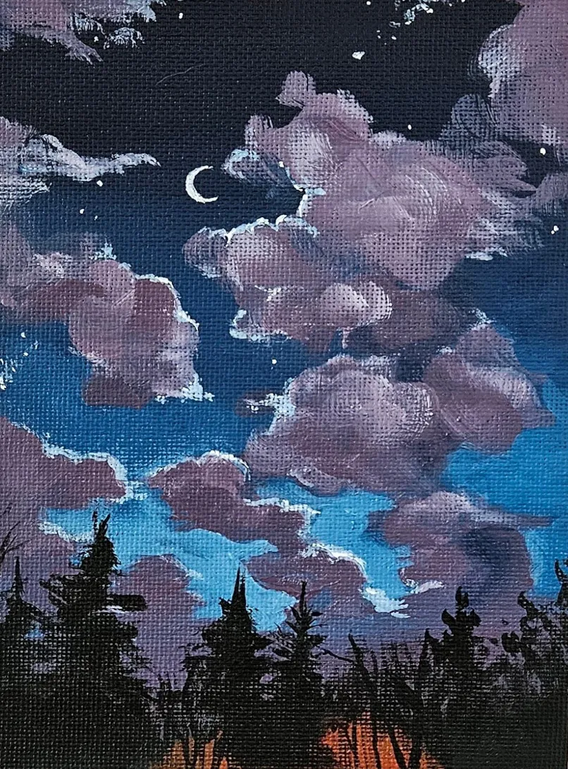 Twilight sky with fluffy purple clouds, orange glow behind a line of black trees, small crecent moon