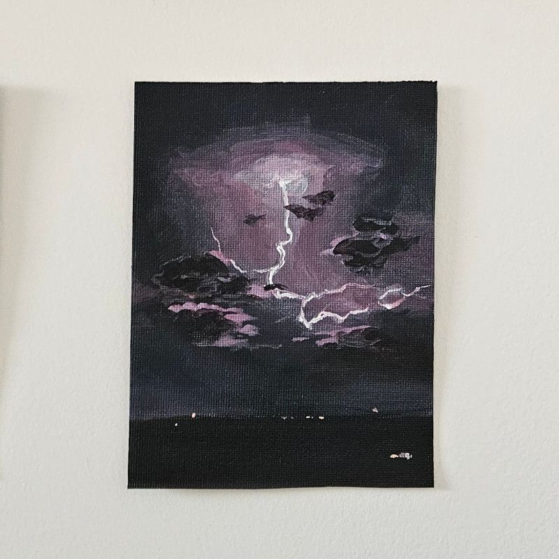 Painting of a lightning bolt in black clouds