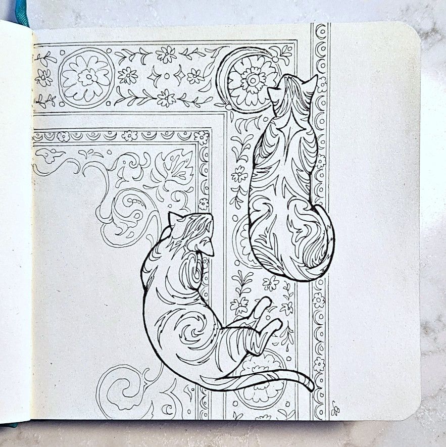 Stylized cats on a rug